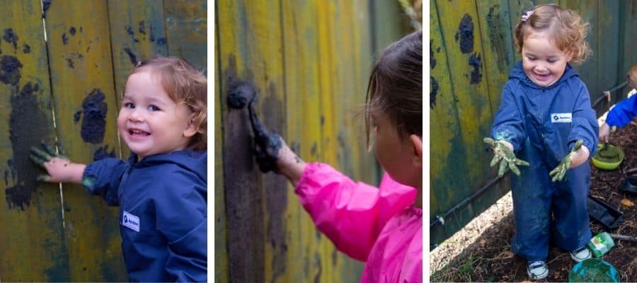 3 children mud painting wearing Mud Mates coveralls and craft aprons
