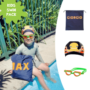 Young boy at swimming pool edge with a personalised NZ-made swim bag, Otto the Octopus swim cap and Funkies Goggles